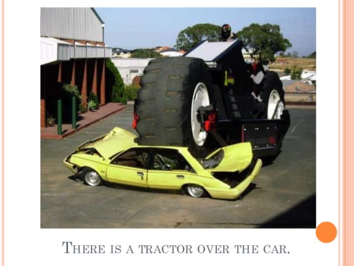 There is a tractor over the car.